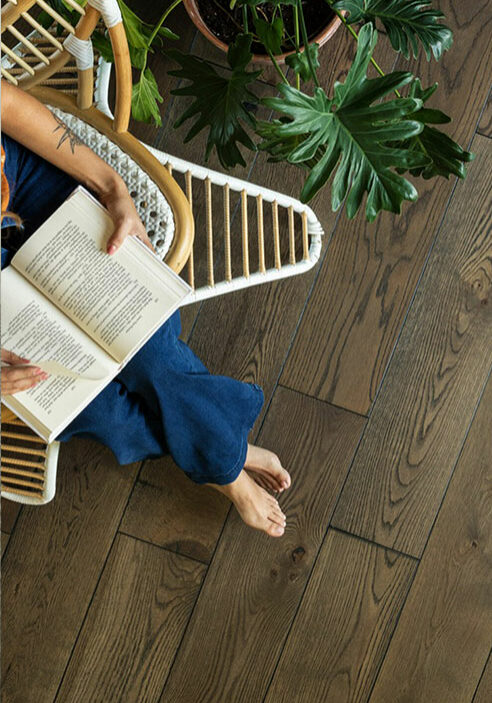 Lady reading book | Ultimate Flooring Design Center